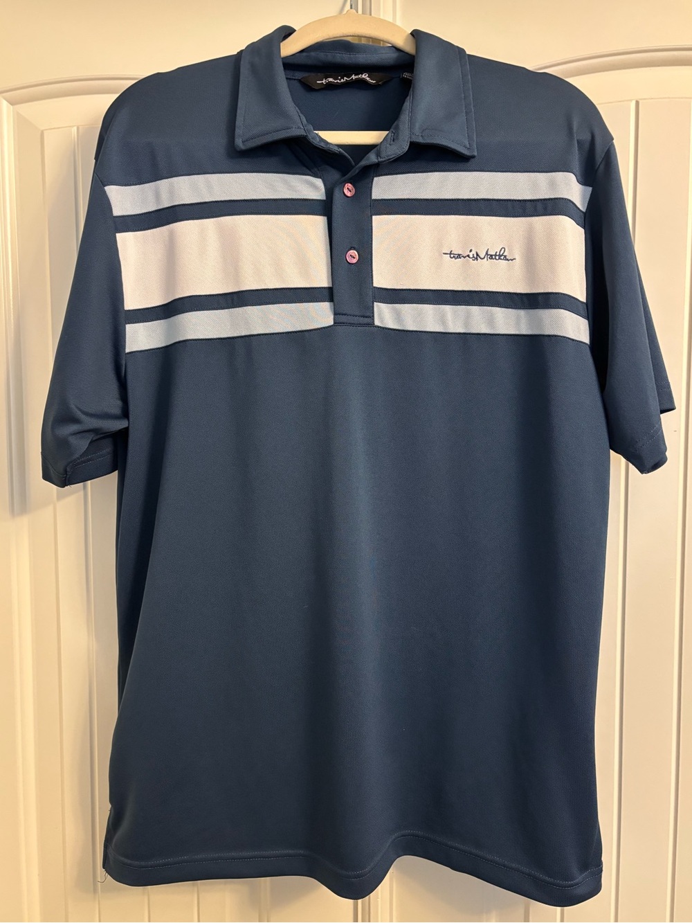 TravisMathew Navy Polo with White Chest Stripes